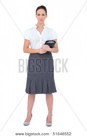 Content businesswoman holding datebook on white background