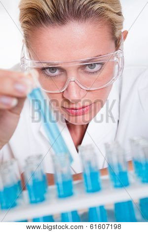 Lab Technician Woman Looking At Testubes