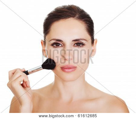 Beautiful Woman Applying Blusher