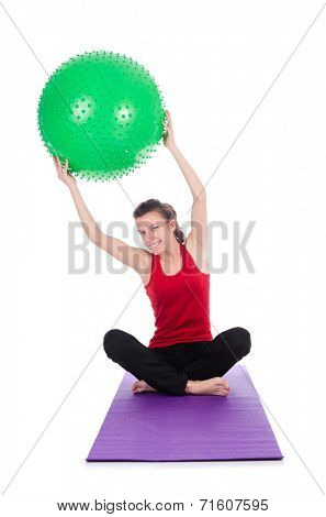 Young woman exercising with swiss ball
