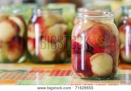 Jars of homemade fruit preserves - peach compote
