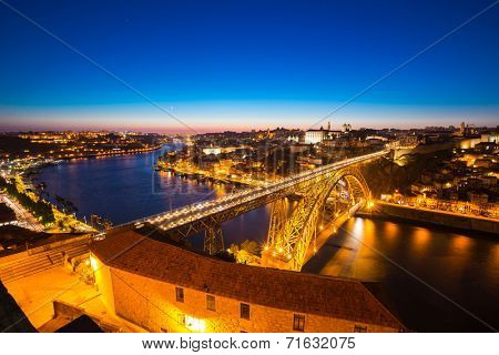 Dom Luiz bridge in Porto Portugal at dusk