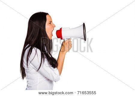 Young woman shouting through megaphone on white background