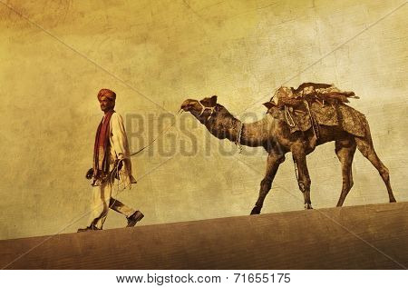 Indigenous Indian man walking through the desert with his camel.