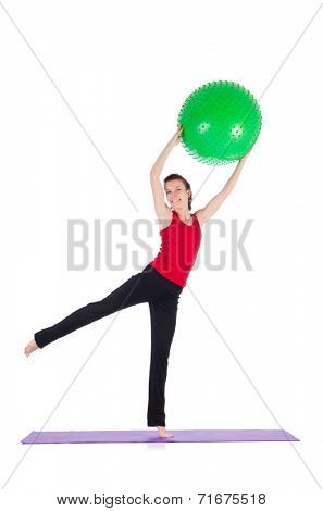 Young woman exercising with swiss ball