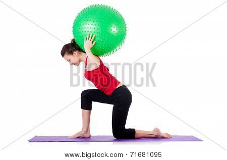 Young woman exercising with swiss ball
