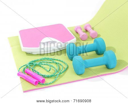 Sports requisites on sport mat isolated on white