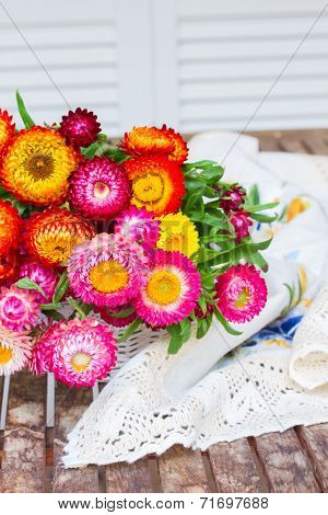 Bouquet of Everlasting flowers on table
