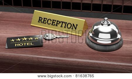 Hotel reception bell and and key on reception wooden desk