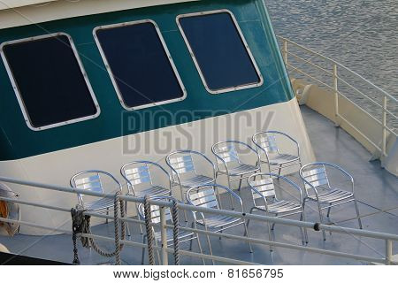 Deck Chairs Lined Up On Tour Boat Fore-deck