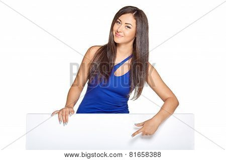 Young pretty woman peeking out from behind the wall