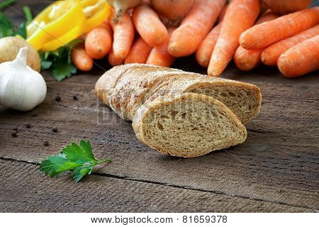 Bread with fresh vegetables on the table