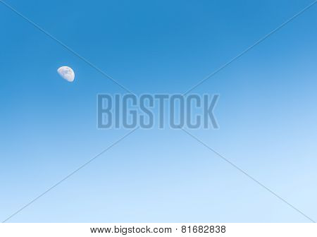 The Moon In The Day On Blue Sky