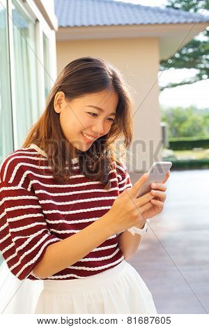 Portrait Of Beautiful Young Woman Reading Message In Smart Phone Use For Modern People Digtal Life I
