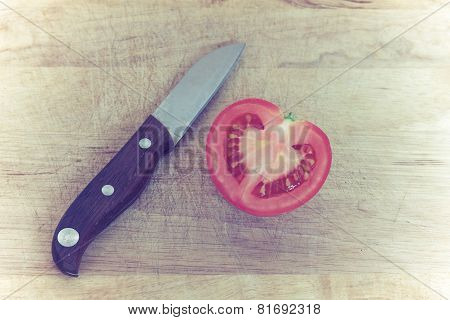 Cleave Of Red Potato,look Like Heart Shape,with Knife On Wooden Board