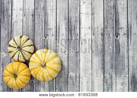 three Yellow and green pumpkin