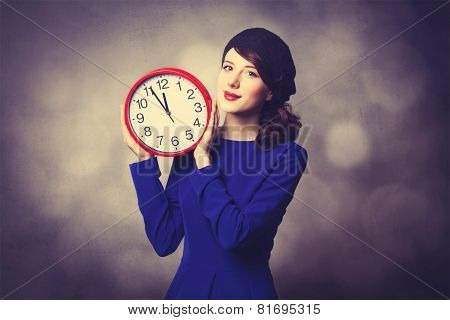 Women In Blue Dress With Huge Clock