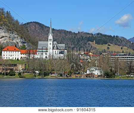 Church With Bell Tower On The Shore Of Lake Bled