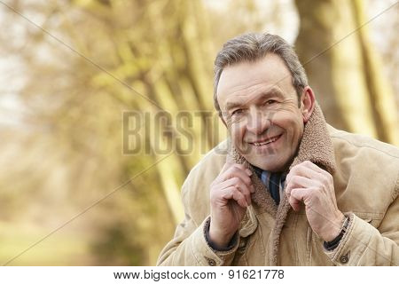 Portrait senior man outdoors in winter