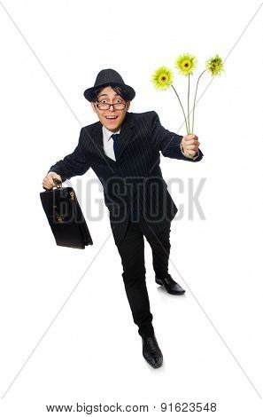 Young man in black costume with flower isolated on white