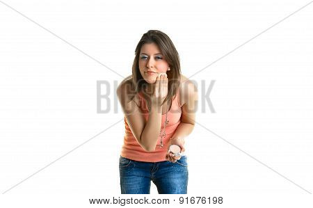 Beautiful young woman putting on make-up