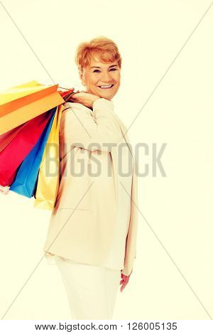 Happy business woman holging shopping bags