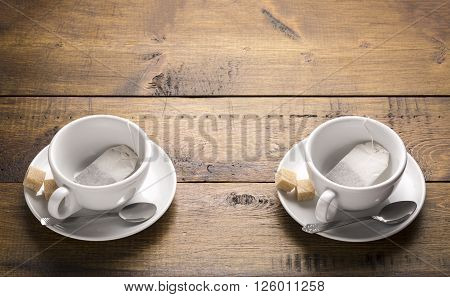 Preparation for brewing tea.Set of two ceramic tea mugs with sachet.