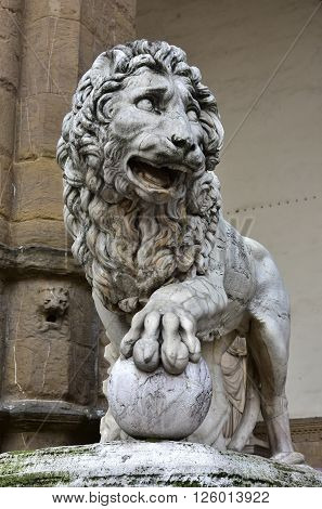 Marble lion statue at the entrance (left side) of Loggia dei Lanzi in Florence made by artist Flaminio Vacca in 1598