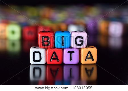 Big Data word on colorful dice with reflection