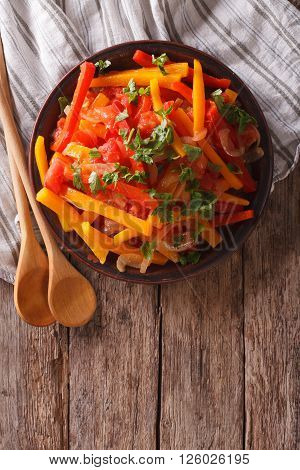 Stewed Peppers With Tomatoes And Onions Close Up. Vertical Top View