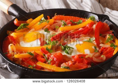 Breakfast: Fried Eggs With Peppers In A Pan Close-up. Horizontal