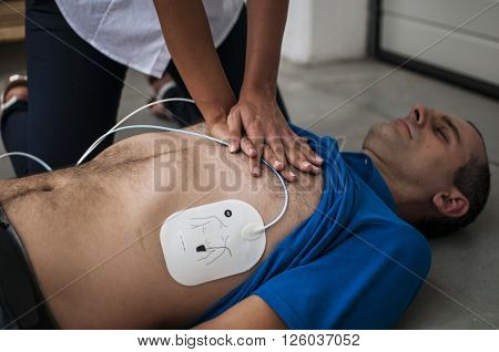 cardiac compression chest to an unconscious man
** Note: Soft Focus at 100%, best at smaller sizes
