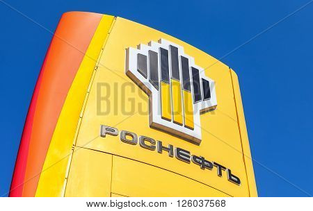 SAMARA RUSSIA - APRIL 16 2016: The emblem of the oil company Rosneft against the blue sky background. Rosneft is one of the largest russian oil companies