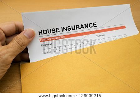 House Insurance application form on brown envelope