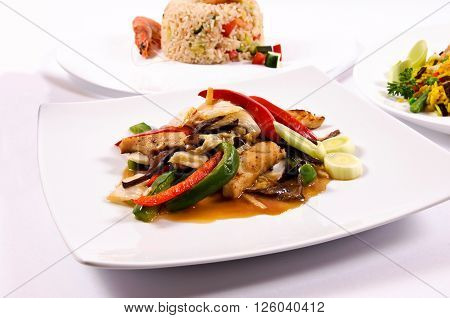 Image of chicken and vegetables on rustic background