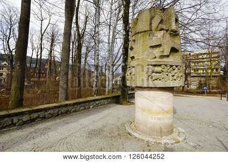 ZAKOPANE POLAND - MARCH 06 2016: Monument to Mountain Rescuers is made of stone appear scenes of mountain rescuers in action. It is the work of Hasior sculptor and painter and was unveiled in 1959