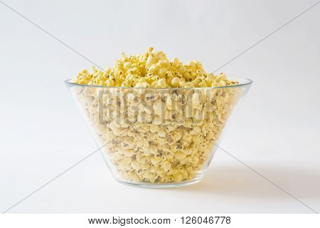 Full Glass Bowl of Popcorn on White Background