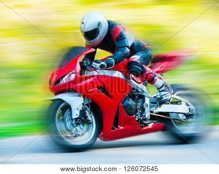 Dynamic and realistic motorbike racing on bright summer background