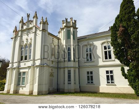 Brunszvik castle in spring with cloudy background