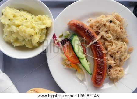 Sausage with cabbage, highway restaurant in Pentling, Germany on June 07, 2015.
