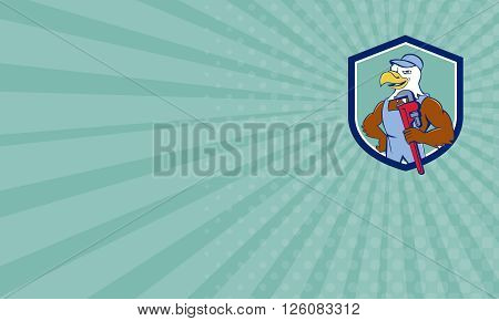 Business card showing illustration of an american bald eagle plumber wearing hat holding monkey wrench looking to the side set inside shield crest done in cartoon style.