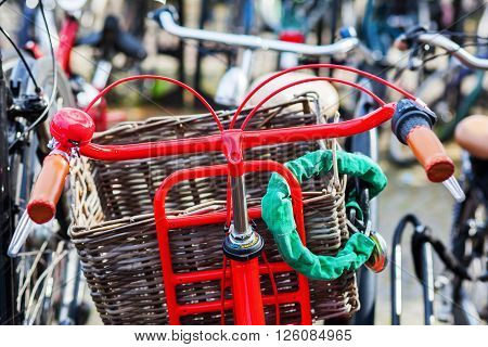 red bicycle at a bicycle parking lot in a Dutch city