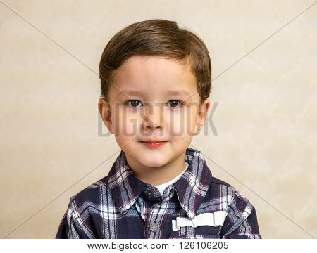 Little boy portrait in shirt. Smile. Childhood.