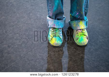 Bright dust on Vintage colorful shoes on puddle