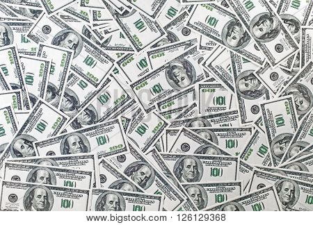 Background from a variety of one hundred dollar bills. Many dollars. Money background. Fake money.