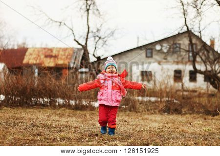 The Little children playing in the street.