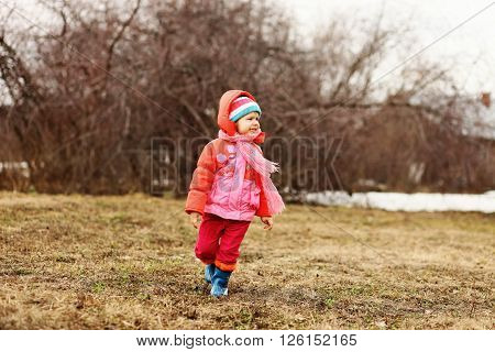 The Little children playing in the street.