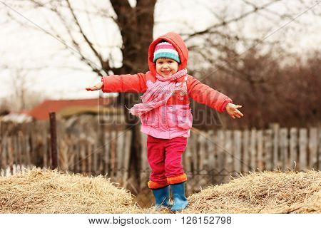 The Little children playing in the street.
