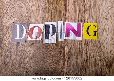 doping text made with newspaper letters on wood