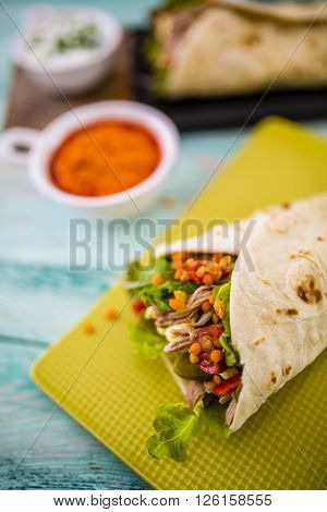 Tortilla with pulled pork, fresh vegetables
